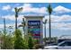 An exterior shot of Lowe's and the shopping center's directory sign surrounded by palm trees at 12654 Oak Hill Way, Parrish, FL 34219