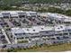 Overview of a vibrant shopping center with stores like Marshall's and Five Below, parking, and landscaping at 12654 Oak Hill Way, Parrish, FL 34219