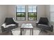 Sitting room with plush chairs, a view of the water, and lots of natural light at 12654 Oak Hill Way, Parrish, FL 34219