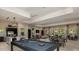 Spacious clubhouse featuring a billiard table, stainless steel appliances, and comfortable seating areas at 6237 Plateau Ct, Bradenton, FL 34203