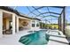 Private screened-in pool and spa with a covered patio and ample lounging space at 6237 Plateau Ct, Bradenton, FL 34203