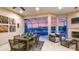 Screened-in pool area with covered patio, dining set, comfortable seating, and sunset views at 6237 Plateau Ct, Bradenton, FL 34203