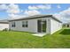 A well-maintained backyard featuring a patio and lush green lawn at 31622 Malbec Ln, Brooksville, FL 34602