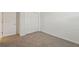 Carpeted bedroom with closet space at 31622 Malbec Ln, Brooksville, FL 34602