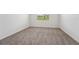 Bedroom with neutral walls, carpet, a window, and ample space at 31622 Malbec Ln, Brooksville, FL 34602