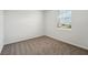 Bright bedroom with a neutral color scheme and a window offering natural light at 31622 Malbec Ln, Brooksville, FL 34602