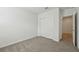Empty bedroom with neutral carpet and white trim at 31622 Malbec Ln, Brooksville, FL 34602