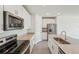 Modern kitchen with white cabinets, granite countertops, and stainless steel appliances at 31622 Malbec Ln, Brooksville, FL 34602