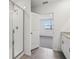 Bright bathroom featuring a glass-enclosed shower, gray tiling, and a vanity with stone countertops at 31673 Wild Grape Sw Ln, Brooksville, FL 34602