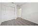 Cozy bedroom with plush carpeting, a closet with sliding doors, and neutral white walls at 31673 Wild Grape Sw Ln, Brooksville, FL 34602