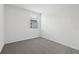 Bedroom with carpet and window at 31673 Wild Grape Sw Ln, Brooksville, FL 34602