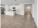 Spacious open-concept kitchen with a large island, stainless steel appliances, and bright white cabinetry at 31673 Wild Grape Sw Ln, Brooksville, FL 34602