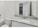 Bathroom featuring a white vanity with granite countertops, undermount sink and tile backsplash at 3561 Moscato Dr, Brooksville, FL 34602