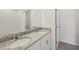 Bright bathroom featuring a double vanity with granite countertops and modern fixtures at 3561 Moscato Dr, Brooksville, FL 34602