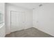 Bedroom featuring neutral carpet, natural light, and a sliding door closet at 3561 Moscato Dr, Brooksville, FL 34602