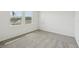 Bedroom featuring neutral carpet and natural light through window with blinds at 3561 Moscato Dr, Brooksville, FL 34602