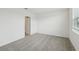 Bedroom featuring neutral carpet and natural light through window with blinds at 3561 Moscato Dr, Brooksville, FL 34602