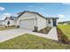 Beautiful one-story home with green lawn and manicured flowerbeds at 3561 Moscato Dr, Brooksville, FL 34602