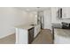 Bright kitchen features granite countertops, stainless appliances, and island with sink, offering a modern and functional space at 3561 Moscato Dr, Brooksville, FL 34602