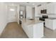 Modern kitchen with stainless steel appliances and a spacious island at 3561 Moscato Dr, Brooksville, FL 34602