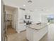 Open kitchen with granite countertops, stainless steel appliances, and island sink at 3561 Moscato Dr, Brooksville, FL 34602