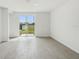 Bright, modern living room with sliding glass doors at 3561 Moscato Dr, Brooksville, FL 34602