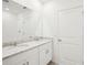 The bathroom features a granite countertop with double sinks and white cabinets at 3568 Moscato Dr, Brooksville, FL 34602