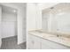 Beautiful bathroom featuring double sinks, granite countertops, and a walk-in closet at 3568 Moscato Dr, Brooksville, FL 34602