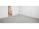Comfortable bedroom with plush carpet and an en suite bathroom and walk-in closet at 3568 Moscato Dr, Brooksville, FL 34602