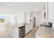 Kitchen island with stainless steel appliances, granite countertops and breakfast bar at 3568 Moscato Dr, Brooksville, FL 34602