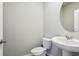 Half bathroom featuring a stylish pedestal sink and toilet at 3824 Radiant Mountain Dr, Plant City, FL 33565