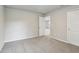 Bedroom offers neutral carpet, neutral paint, and entrance to an ensuite bathroom at 3824 Radiant Mountain Dr, Plant City, FL 33565