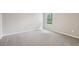 Bedroom featuring neutral carpet, window with blinds, and neutral paint at 3824 Radiant Mountain Dr, Plant City, FL 33565