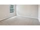 Bedroom featuring neutral carpet, window with blinds, and neutral paint at 3824 Radiant Mountain Dr, Plant City, FL 33565
