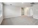 Spacious bedroom with neutral paint, carpet, window with blinds and ensuite bathroom entrance at 3824 Radiant Mountain Dr, Plant City, FL 33565