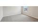 Bedroom featuring neutral carpet, window with blinds, and neutral paint at 3824 Radiant Mountain Dr, Plant City, FL 33565