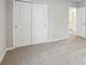 Bedroom features a carpeted floor, closet with sliding doors and ensuite bathroom entrance at 3824 Radiant Mountain Dr, Plant City, FL 33565