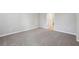 Cozy bedroom with neutral carpeting, base molding, and access to ensuite bath at 3824 Radiant Mountain Dr, Plant City, FL 33565