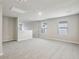 Bright bonus room offers neutral paint, carpet, recessed lighting, natural light, and an open staircase at 3824 Radiant Mountain Dr, Plant City, FL 33565