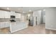 Bright kitchen features stainless steel appliances, granite counters, and an island with bar seating at 3824 Radiant Mountain Dr, Plant City, FL 33565