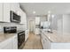 New kitchen boasts granite countertops, stainless steel appliances, and a functional island at 3824 Radiant Mountain Dr, Plant City, FL 33565