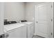 Well-lit laundry room with washer and dryer hookups and convenient access at 3824 Radiant Mountain Dr, Plant City, FL 33565