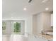 Bright, airy living space with access to the backyard through sliding glass doors at 3824 Radiant Mountain Dr, Plant City, FL 33565