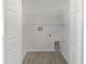 Empty walk-in closet with white walls, shelving and modern flooring at 5211 Mango Fruit St, Seffner, FL 33584