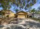 Charming home with a well-manicured lawn and two-car garage at 5211 Mango Fruit St, Seffner, FL 33584