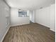 Bright living room with hardwood floors and neutral paint, offering a spacious feel at 5211 Mango Fruit St, Seffner, FL 33584