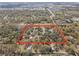 Aerial view of a residential property with mature trees defining a large lot at 3634 Apfel Rd, Wesley Chapel, FL 33543