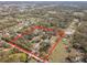 Aerial view highlighting the property's expansive wooded land and pond at 3634 Apfel Rd, Wesley Chapel, FL 33543