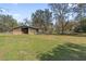Picturesque barn set on a spacious lot, ideal for storage or equestrian activities at 3634 Apfel Rd, Wesley Chapel, FL 33543