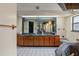 Elegant bathroom with double sinks, a soaking tub, tiled floors, and updated fixtures at 3634 Apfel Rd, Wesley Chapel, FL 33543
